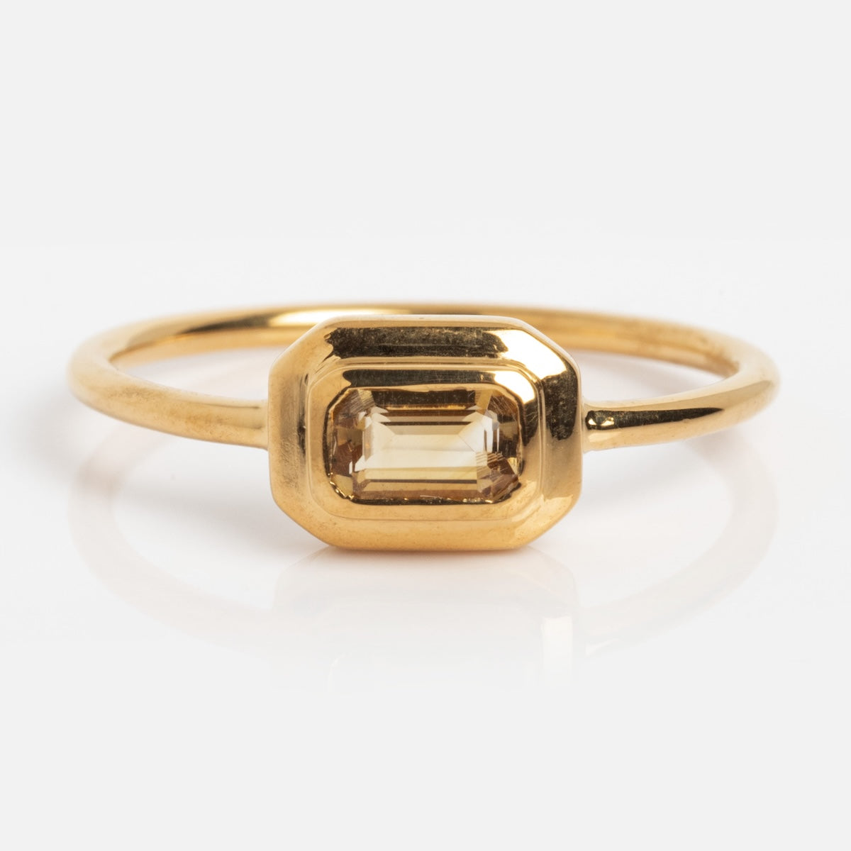 The Vintage Inspired Citrine Bar Ring, sample size 7, features an emerald-cut citrine set in a rectangular bezel on a 14k yellow gold vermeil silver base, shown against a white background.