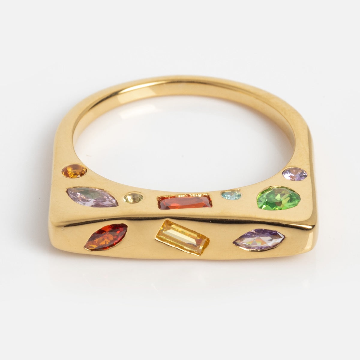 The Bold Hidden Gemstone Signet Ring (Sample Size 7) features a 14k yellow gold-plated, flat squared top set with amethyst and garnet gemstones in various shapes and sizes, displayed on a plain white background.