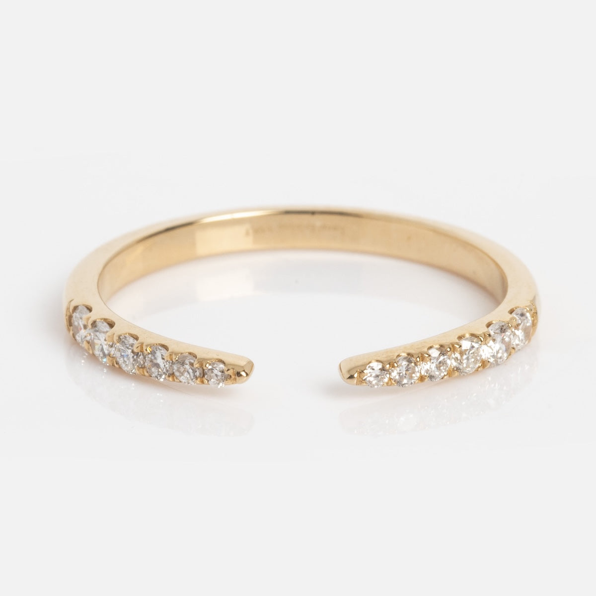 The Solid Gold Diamond Open Tapered Band Sample Size 7 features small round lab diamonds at each end, crafted in 14k yellow gold and shown on a white background.