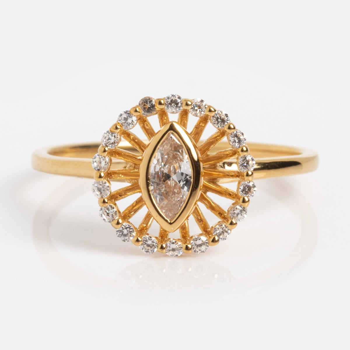 The Vintage Inspired Starburst Halo Ring Sample Size 7 features a marquise-cut central diamond with a sunburst halo of round diamonds on a slim 14k yellow gold vermeil band, shown against a white background.