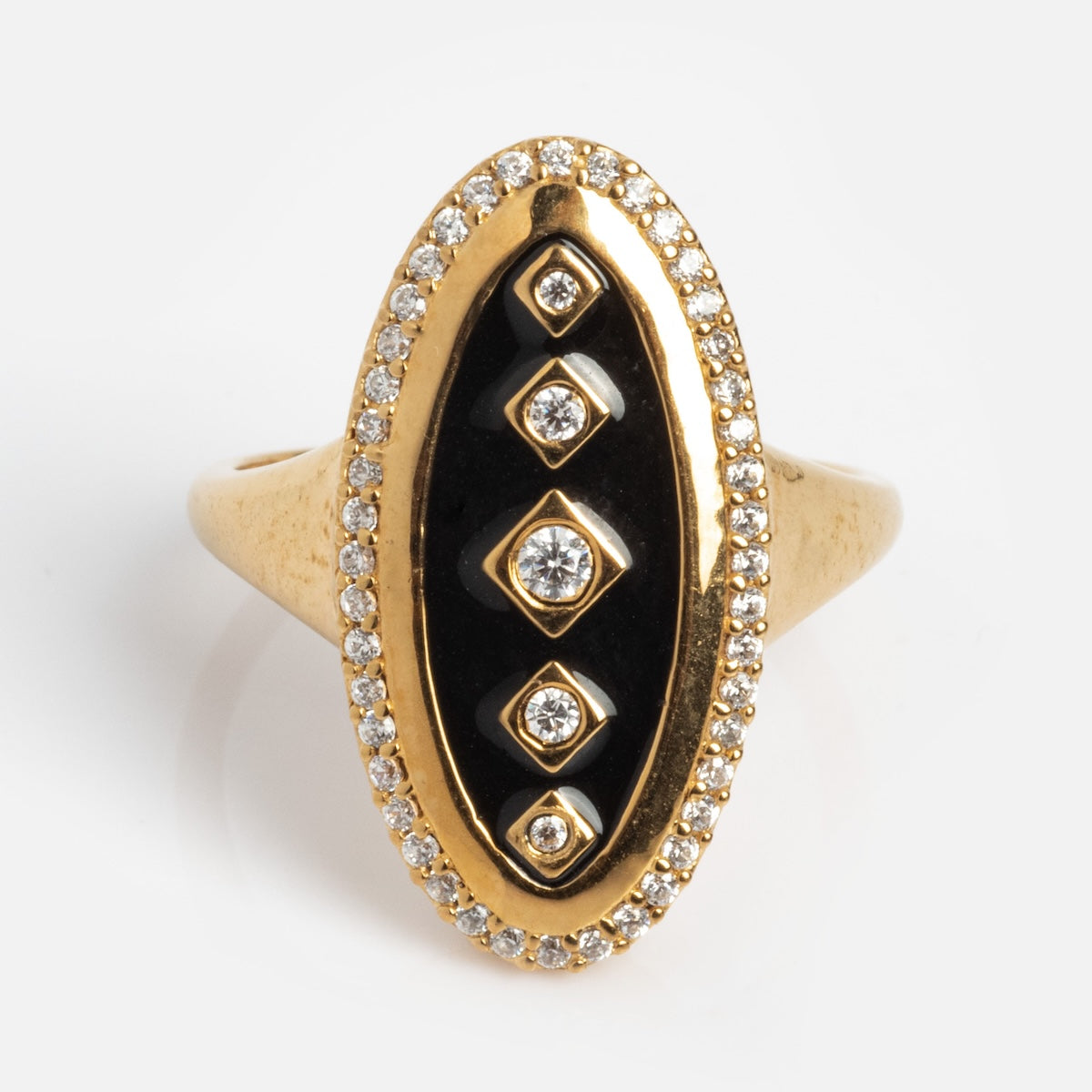 The Vintage Inspired Navette Ring (Sample Size 7) is a 14k gold vermeil piece with an elongated oval black enamel center, four vertical white topaz stones set in gold, and a border of small clear stones on a silver base.