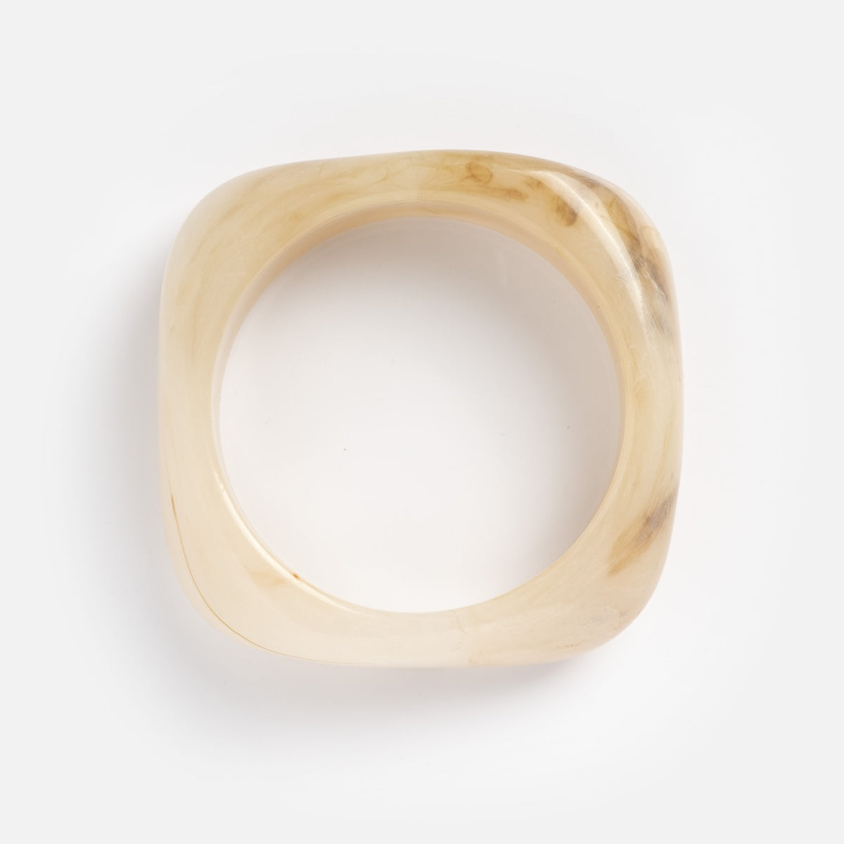 The Bangle Bracelet is square-shaped and crafted from translucent light beige material with subtle brown marbling, shown on a white background.