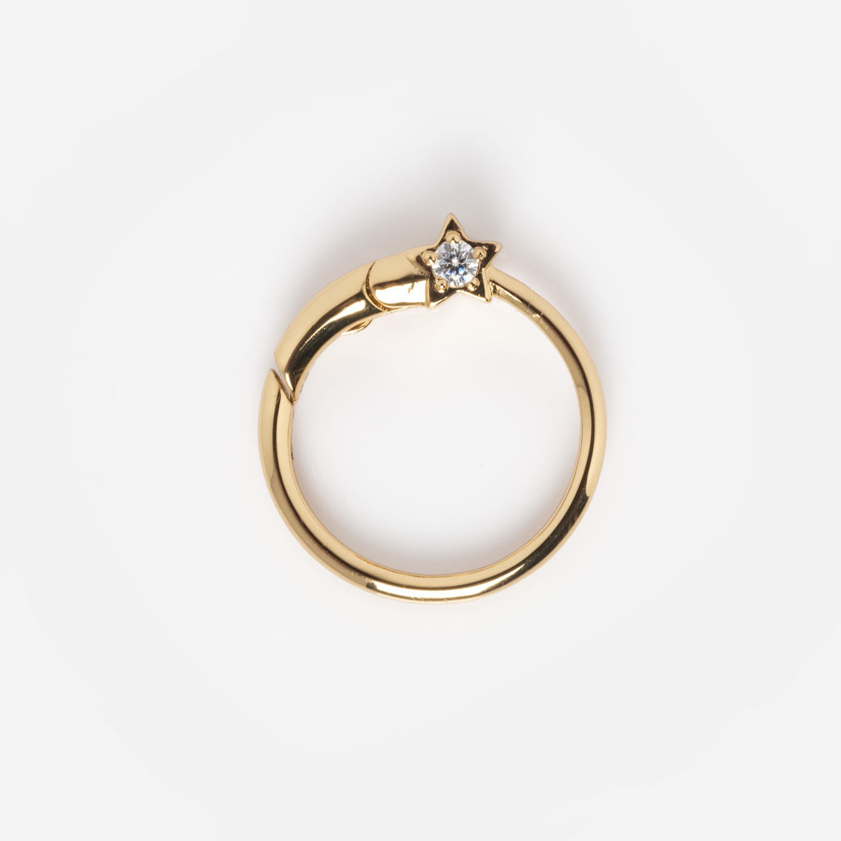 Charms by Elizabeth Stone: A 14k yellow gold plated ring with a small star-shaped setting and clear gemstone, shown on a plain white background.