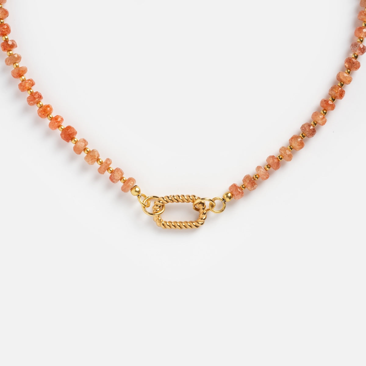 Close-up of the Customizable Beaded Gemstone Charm Holder Necklace featuring small round orange stones and a textured gold oval clasp, displayed against a white background.
