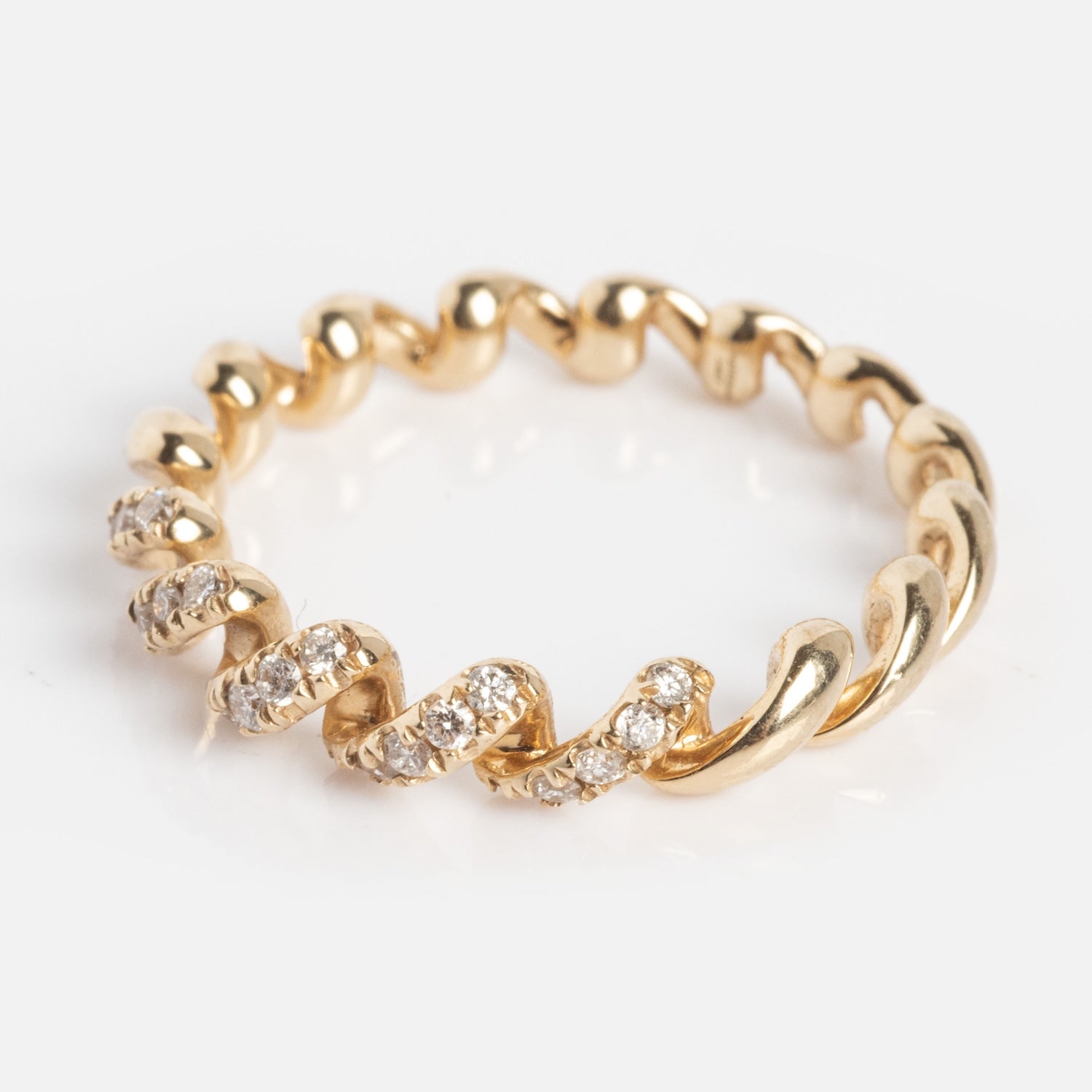 The 14k Fated Twist Diamond Ring features alternating smooth gold and diamond-encrusted sections in a twisted band design, shown against a white background.