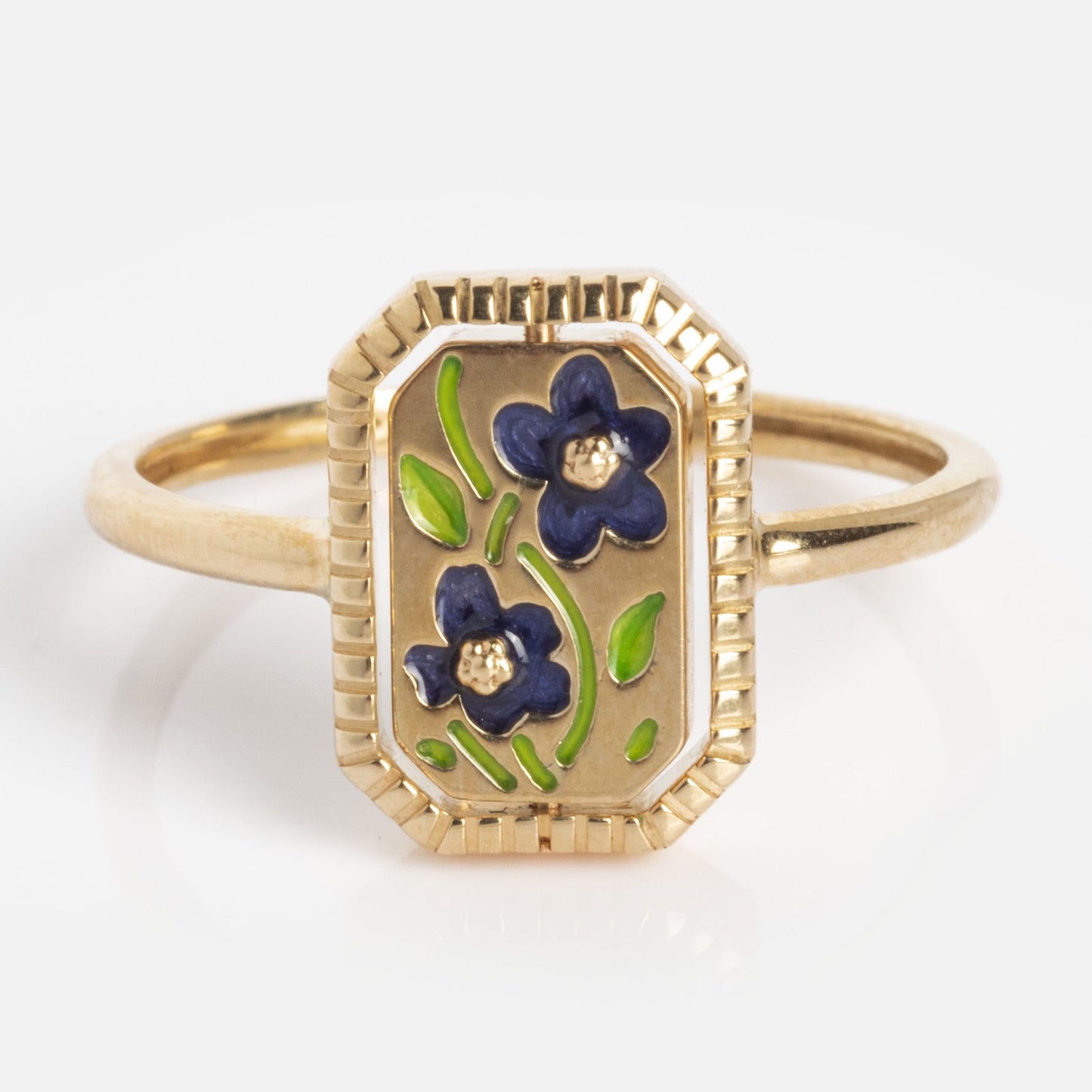 10k Gallery Frames Enamel and Malachite Reversible Ring: features a rectangular face with two blue enamel flowers, green leaves, framed by a grooved gold border on a simple polished band.