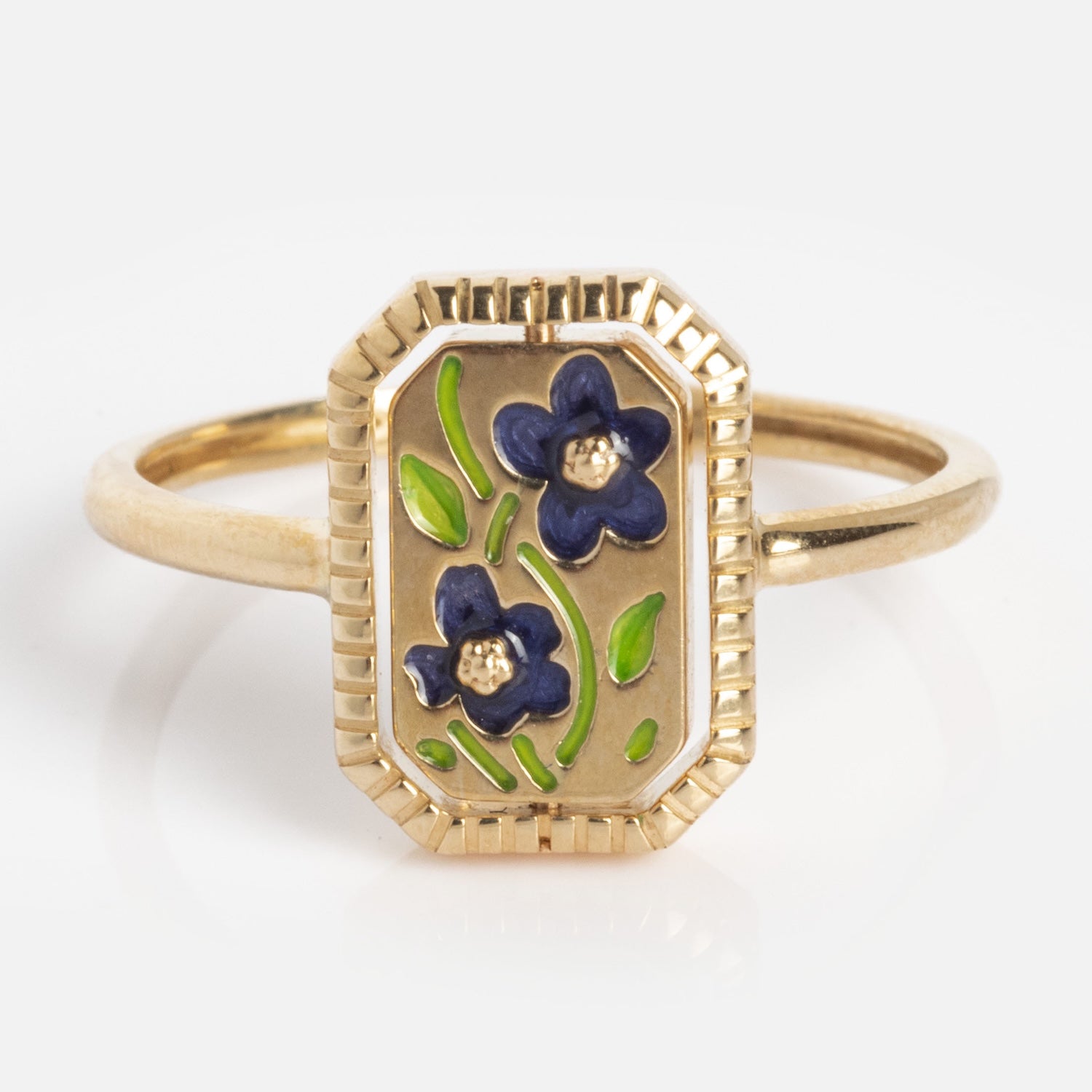 10k Gallery Frames Enamel and Malachite Reversible Ring: features a rectangular face with two blue enamel flowers, green leaves, framed by a grooved gold border on a simple polished band.