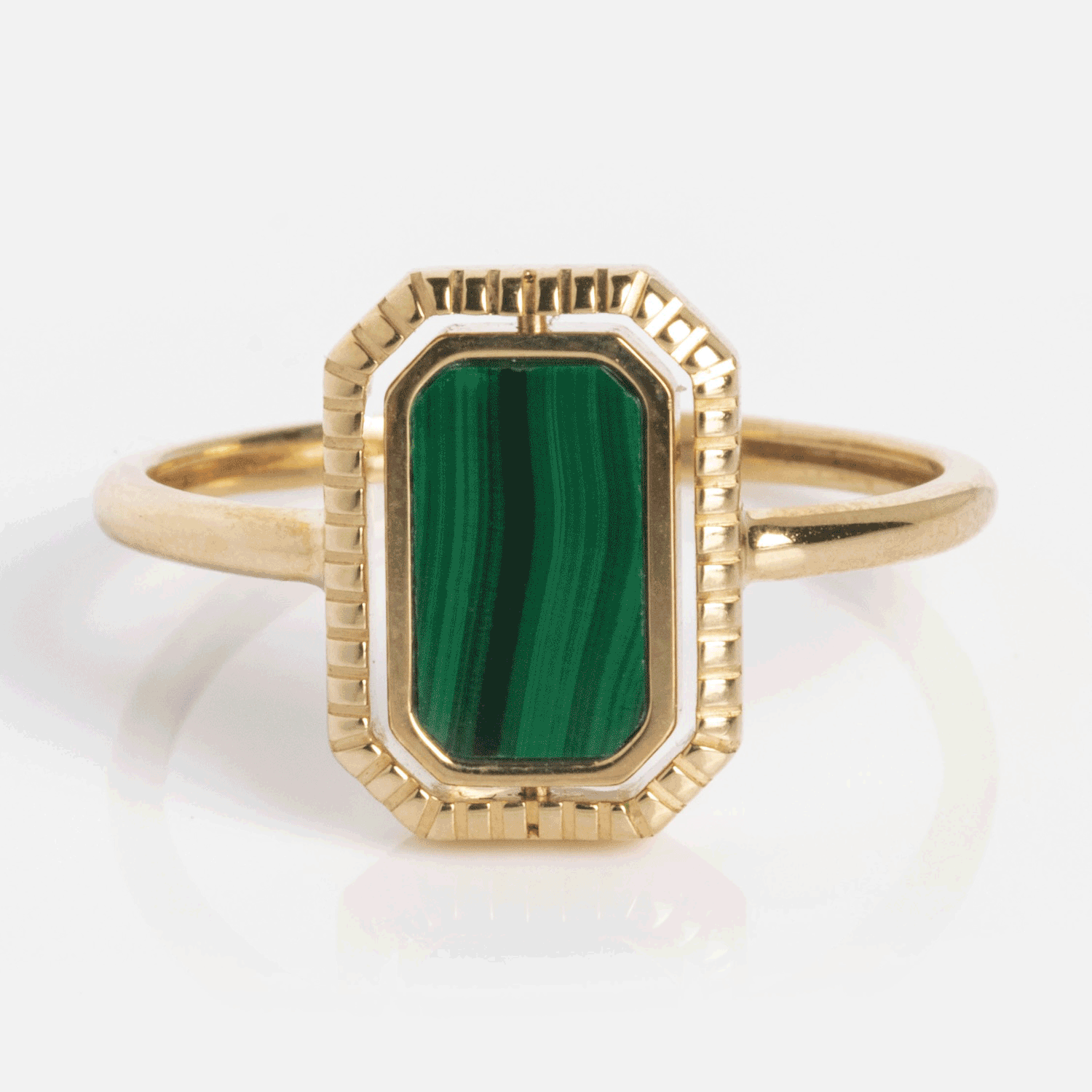 The 10k Gallery Frames Enamel and Malachite Reversible Ring features a rectangular, vertically set green malachite with signature banding, bordered by textured solid gold.