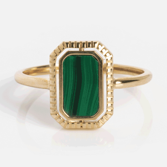 The 10k Gallery Frames Enamel and Malachite Reversible Ring features a rectangular, vertically set green malachite with signature banding, bordered by textured solid gold.