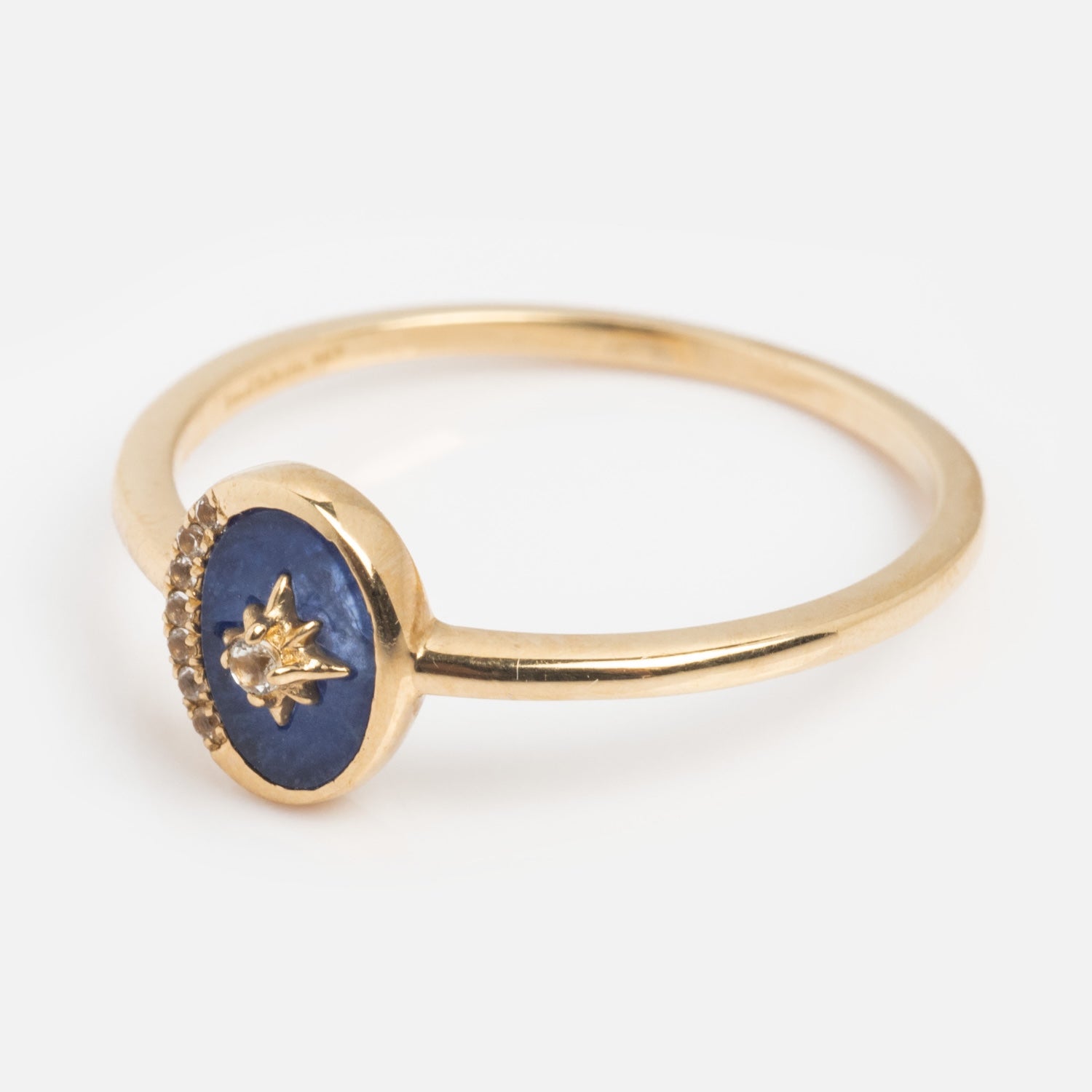 The Solid Gold Crystal Crescent Moon Ring for Manifestation features a round blue stone and a tiny gold star accent on a thin gold band—ideal for those who love natural crystals and celestial-inspired jewelry.