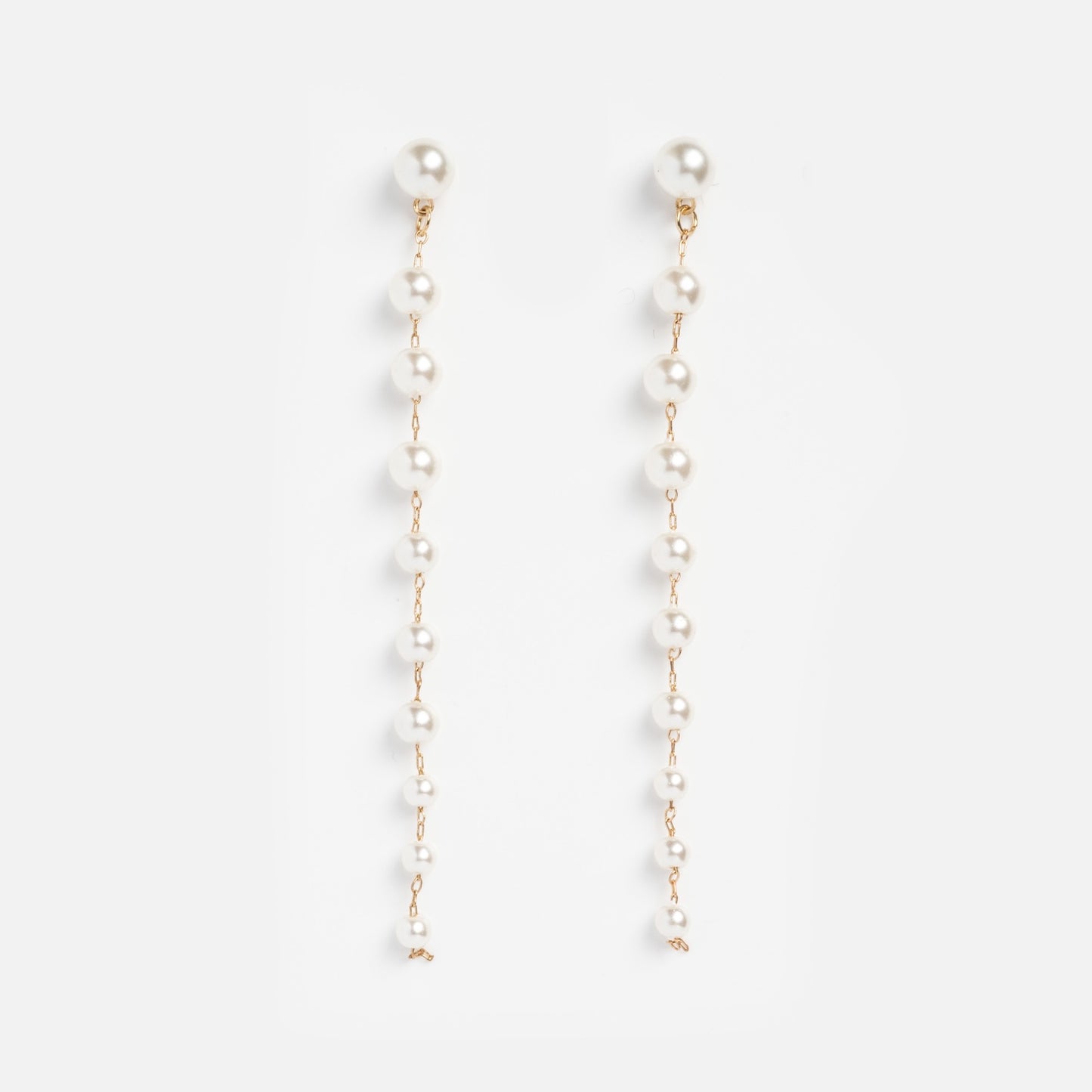The Anais Multi Drop Earrings Sample features long, 14k yellow gold plated drops with small round Swarovski pearls evenly spaced along each earring, shown on a plain white background.
