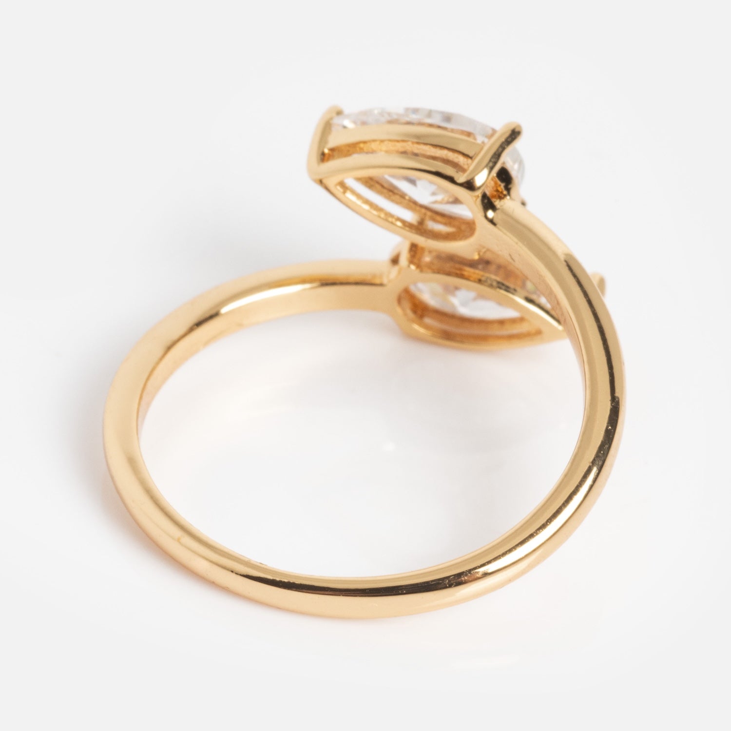 The Crystal Teardrop Wrap Ring features a gold band with a large, clear, oval gemstone in a raised prong setting, shown on a plain white background.