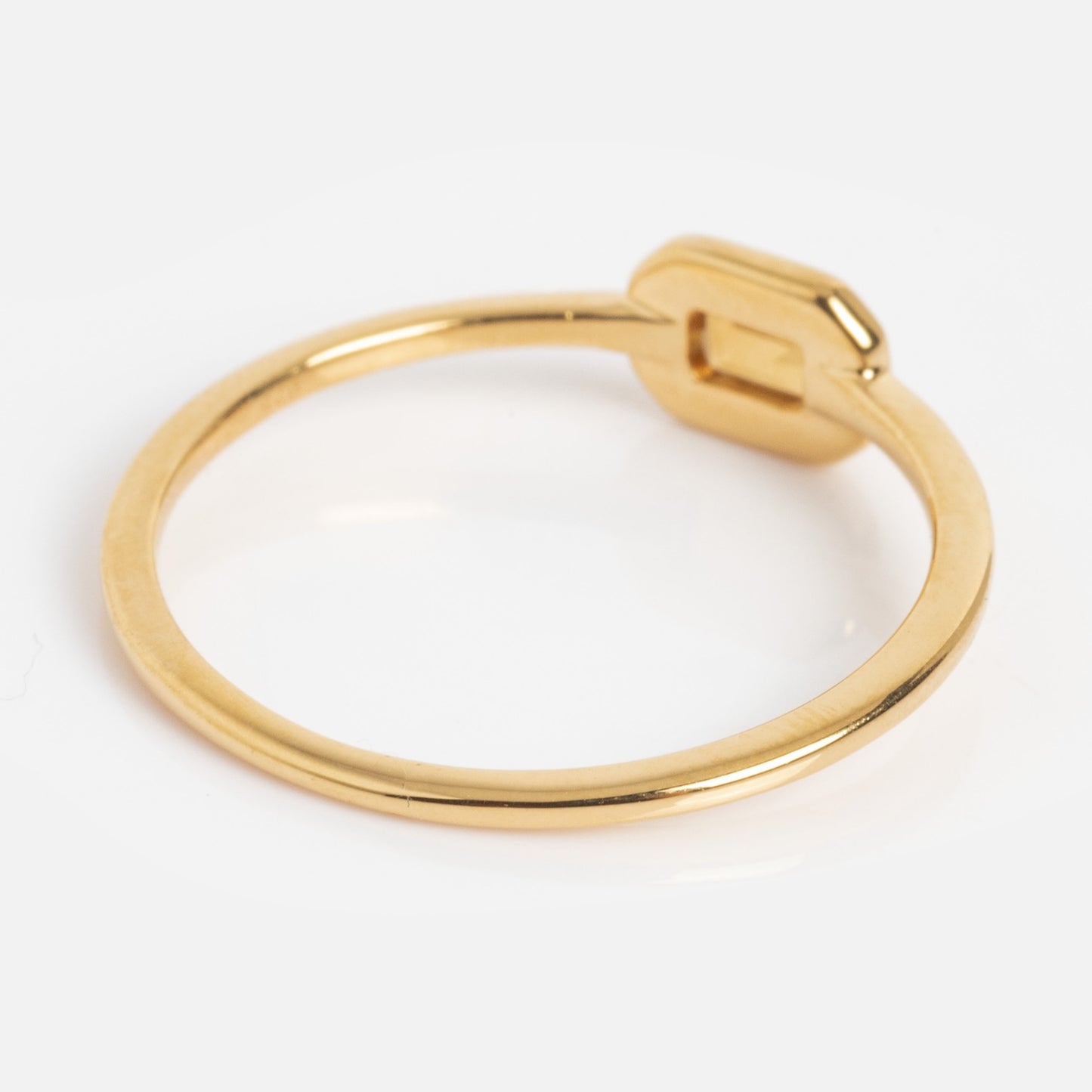 The Matinee Mixed Metal Citrine Ring features a slim band and a small rectangular citrine detail, beautifully presented on a white background.