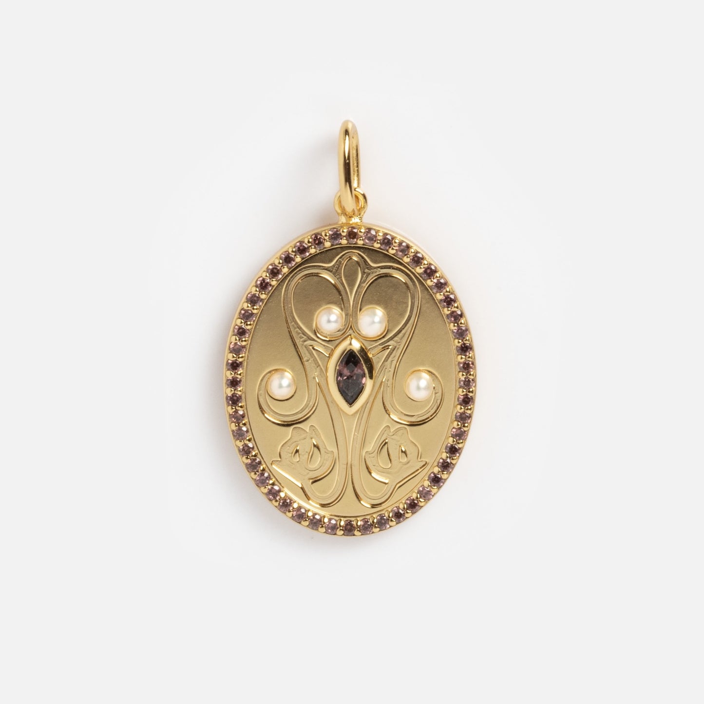 The Vintage Inspired Pendant Charm features an oval gold design with intricate florals, three white pearls, a central dark gemstone, a border of small purple stones, and a white background.