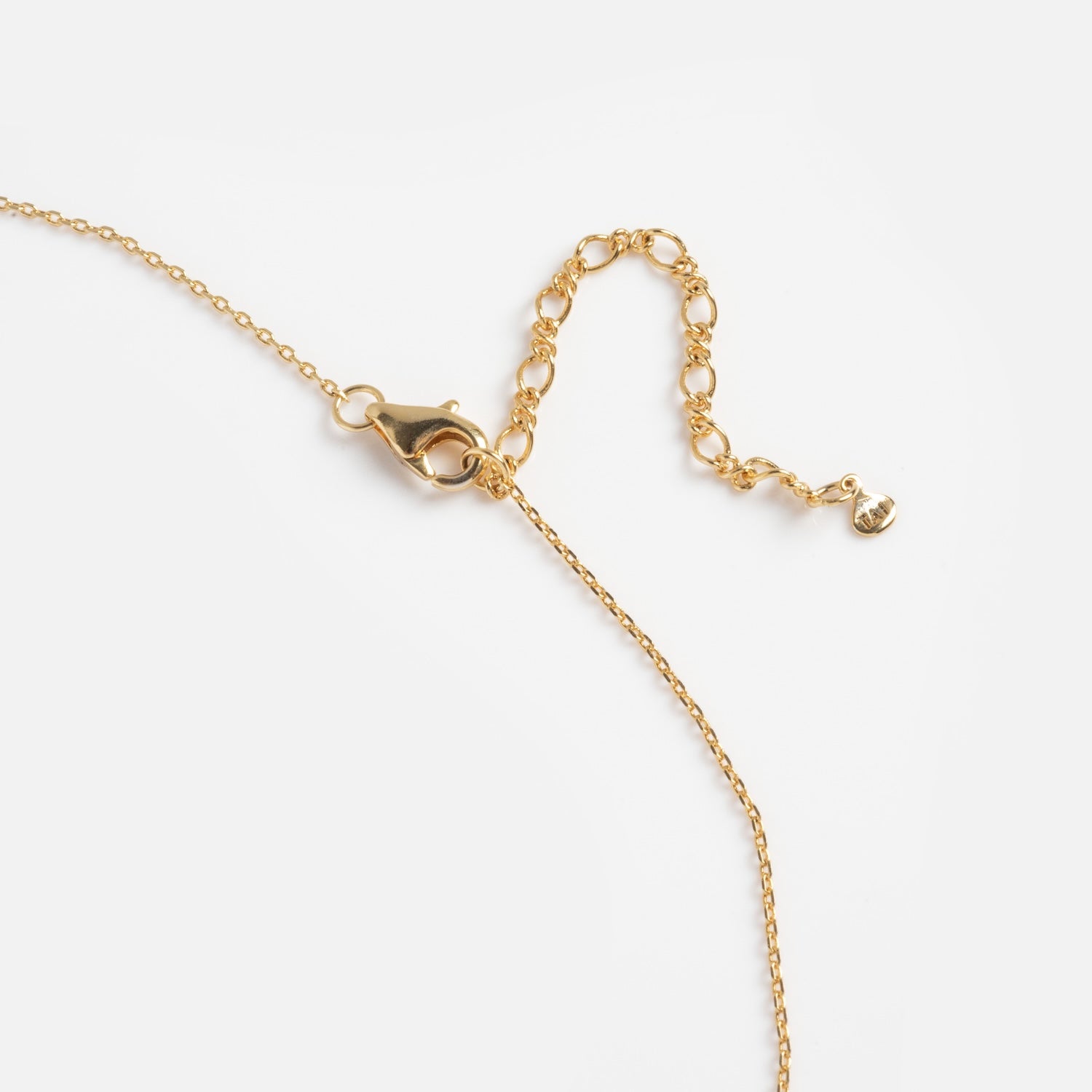 The Floating CZ Station Necklace features a delicate gold chain with small round links, an adjustable extender with a tiny charm, and a lobster clasp, shown on a white background.
