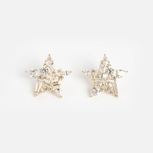 Debut Star Stud Earrings: Gold, star-shaped studs adorned with clear sparkling gemstones, shown on a white background.