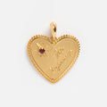 A Local Eclectic exclusive, the Solid Gold Coin Charm features beaded edges, toi toujours engraving, and a star with a red gemstone—making it perfect for personalized jewelry.