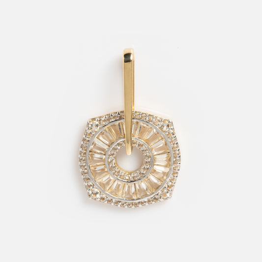 The Solid Gold Coin Charm is a Local Eclectic exclusive pendant crafted in solid gold, featuring a round center with baguette and round-cut stones in a hexagonal design, plus a gold bail for easy attachment to your necklace.