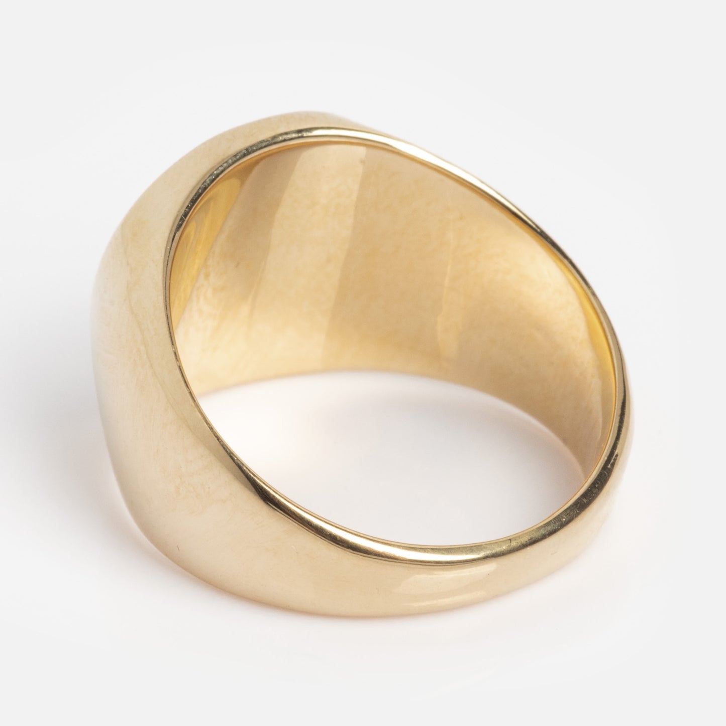 The I Like It Here Club x Local Eclectic Je Ne Sais Quoi Pinky Ring features a shiny yellow gold, wide, slightly curved band with a polished finish, shown against a plain white background.