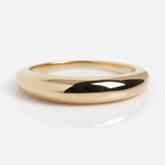 The Pinky Promise Ring in Gold is a sleek, 14K gold-plated ring with a smooth, rounded finish. Shown flat on a white background, it’s the perfect elegant accessory for your pinky finger.