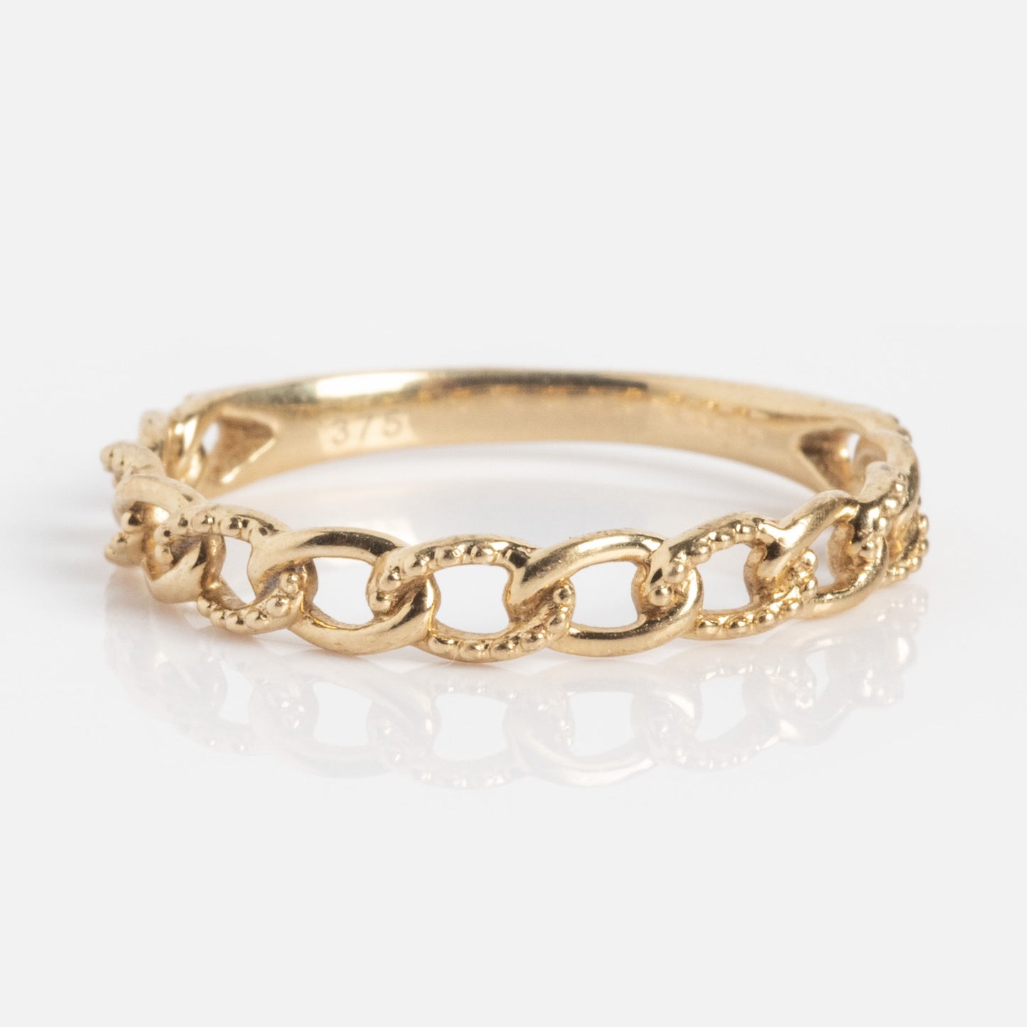 The Solid Gold Textured Chain Link Ring, crafted in 9k gold with interlocking links, is displayed on a white background.