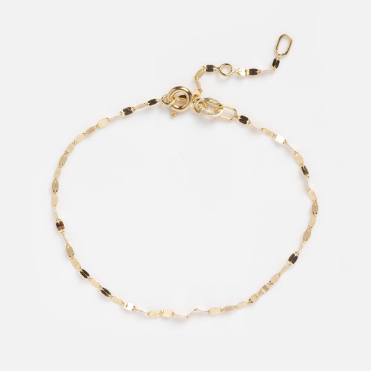 The Solid Gold Bold Sparkle Link Chain Bracelet features a delicate 14k yellow gold chain with small oval links and an adjustable clasp, shown on a plain white background.