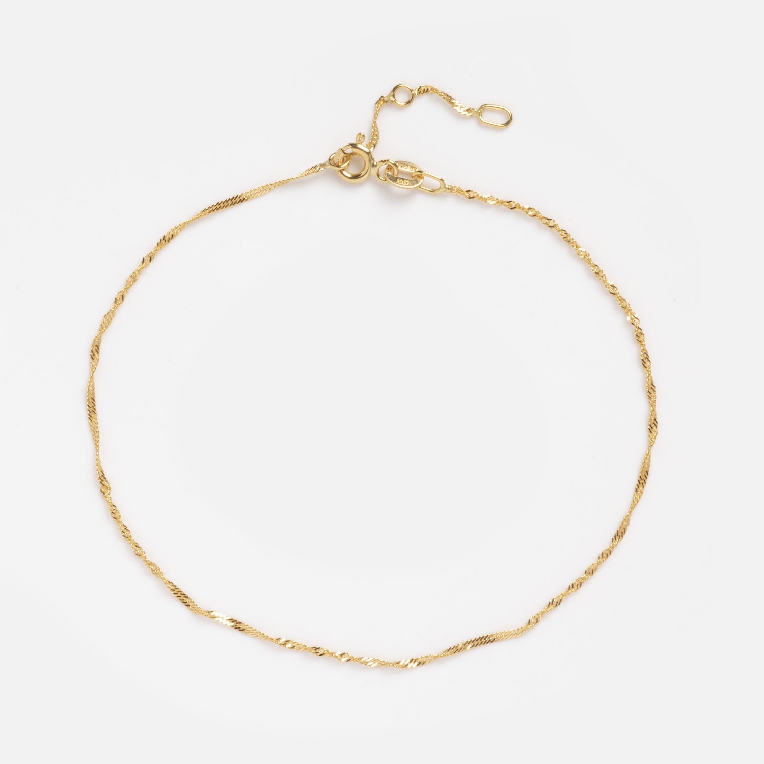 The Solid Gold Twisted Chain Anklet features a delicate 9k gold twisted chain with a small adjustable clasp, shown on a clean white background.