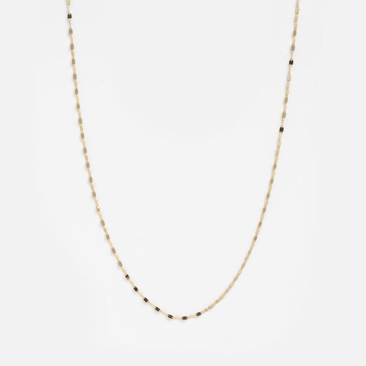 The Solid Gold Sparkle Link Chain is a delicate 14k gold necklace with small, evenly spaced black beads, shown against a plain white background.