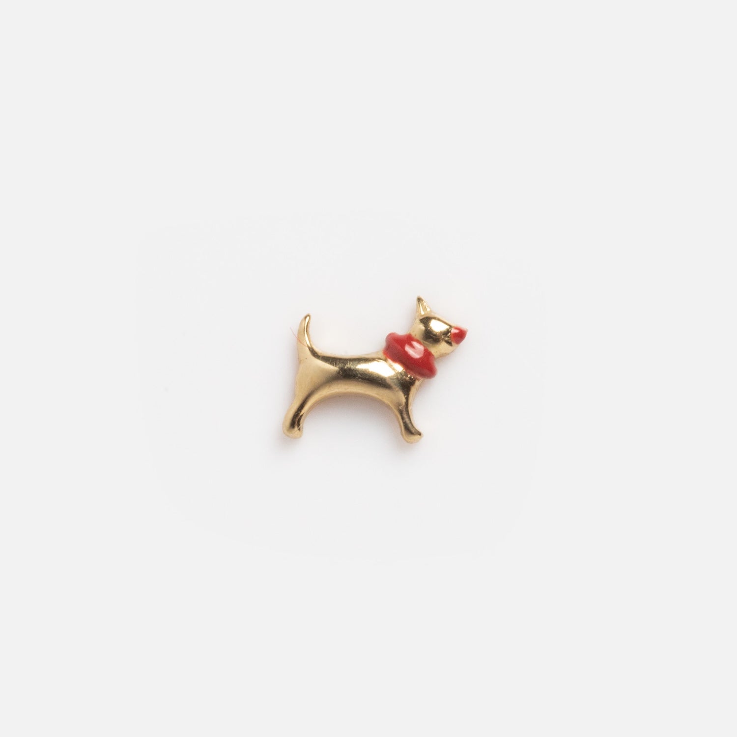 A Solid Gold Tiny Lucky Charm for Glass Charm Locket, shaped like a dog wearing a red collar, is shown against a plain white background.