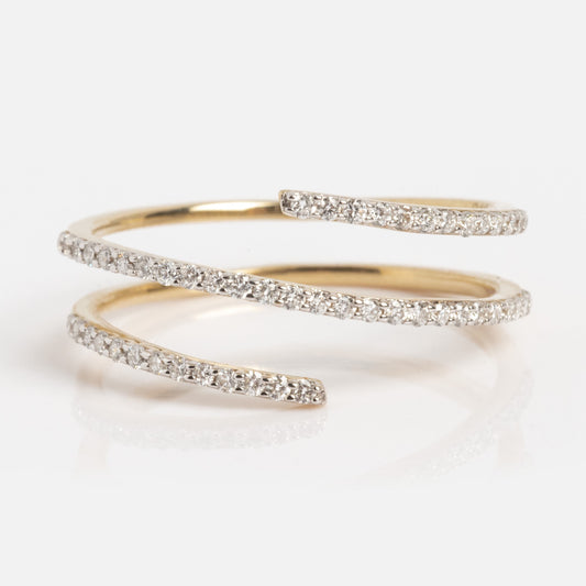 The Solid Gold Shifting Shimmer Diamond Wrap Ring features three overlapping open ends encrusted with small diamonds, arranged in a spiral design and displayed on a white background.