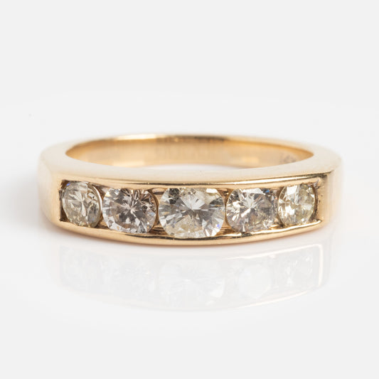 The Vintage 14k Bold Glamour Diamond Band, size 4.5, features five round-cut diamonds set in a row along the gold band and is displayed on a white surface.