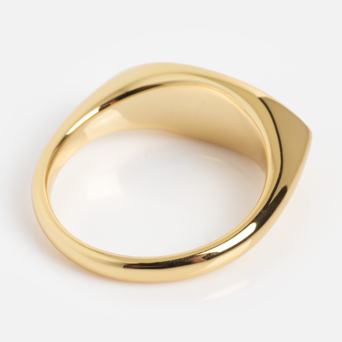 The Colorful Language Fuck Signet Ring features a flat, geometric top and smooth, polished gold finish, displayed against a plain white background.