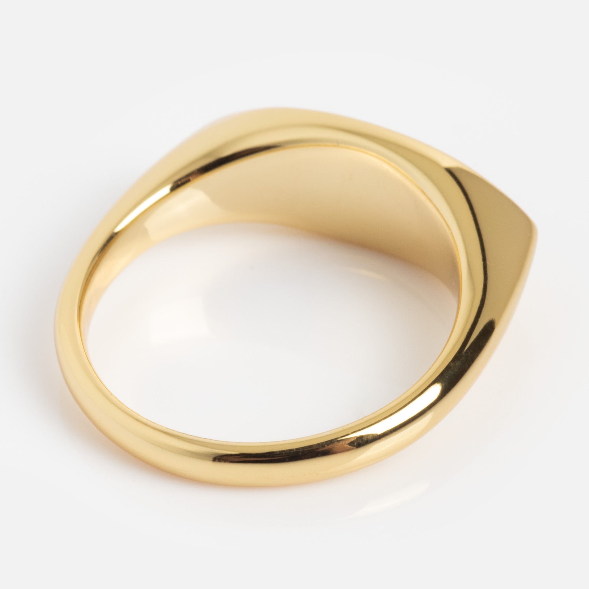 The Colorful Language Fuck Signet Ring features a flat, geometric top and smooth, polished gold finish, displayed against a plain white background.