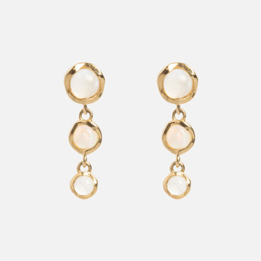 A pair of Solid Gold Horizon Moonstone and Opal Drop Earrings, each featuring three round, white stones arranged vertically, shown on a plain white background.
