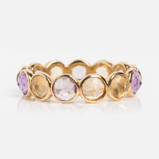 A Solid Gold Sunrise Citrine and Alexandrite Band featuring alternating round citrine and alexandrite gemstones in bezel settings, displayed against a white background.