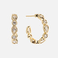 The Isla Hoops are elegant 18k yellow gold earrings with alternating round and teardrop-shaped simulated diamonds in bezel settings, shown against a white background.