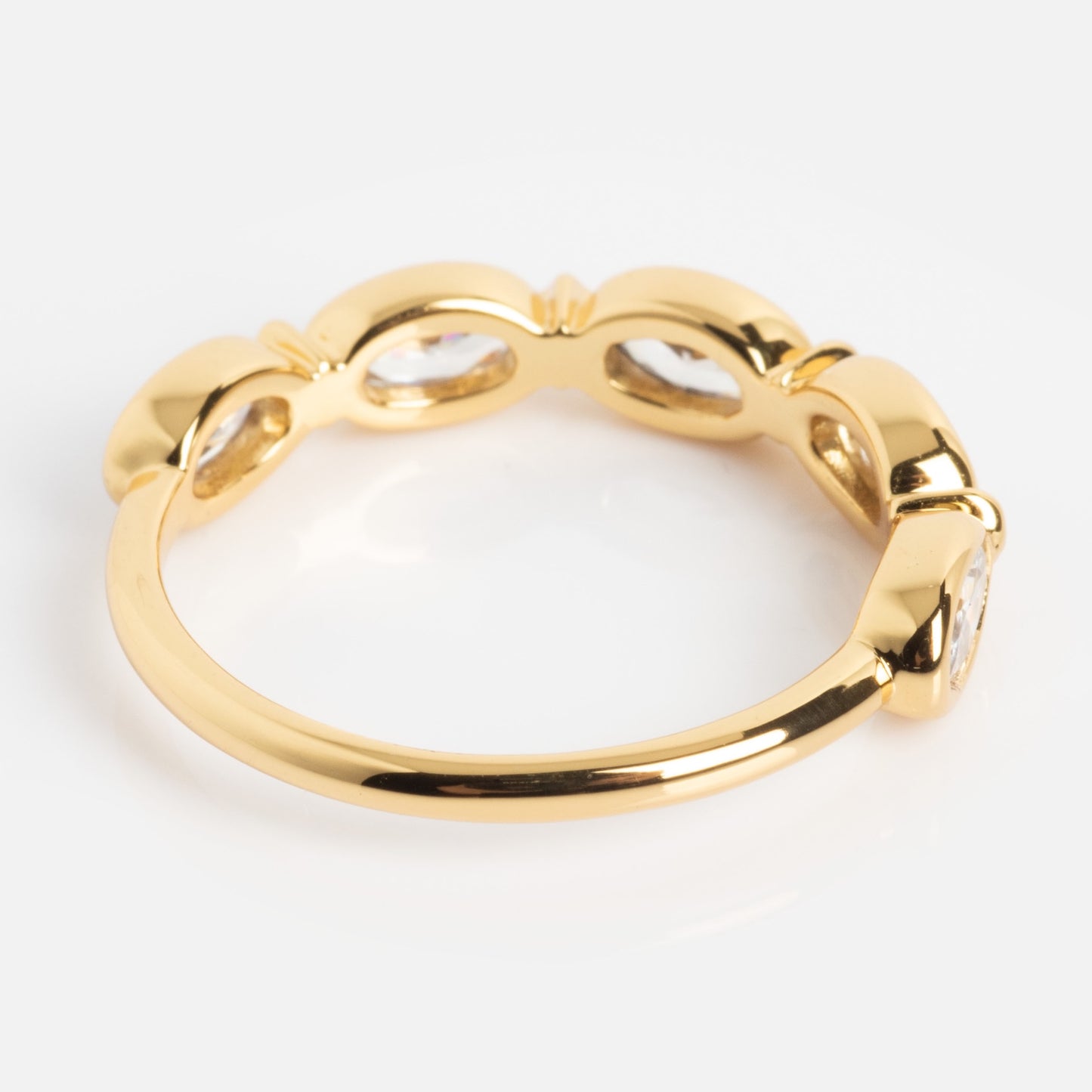 The Bold Moon Beam Stacking Ring features multiple oval-shaped clear gemstones set along the top, shown on a white background.