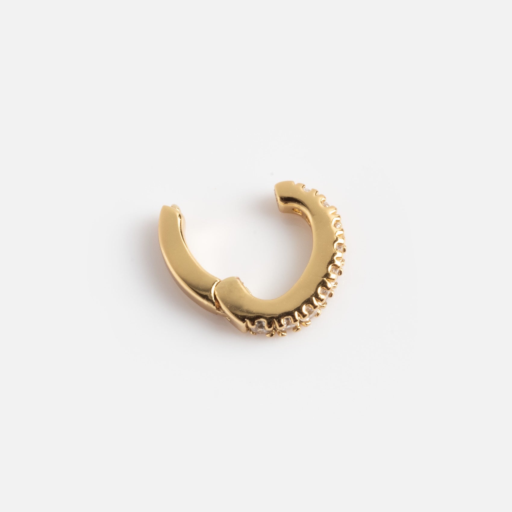 The Ring Clip is a small gold hoop earring featuring a textured beaded design along one edge, shown against a plain white background.