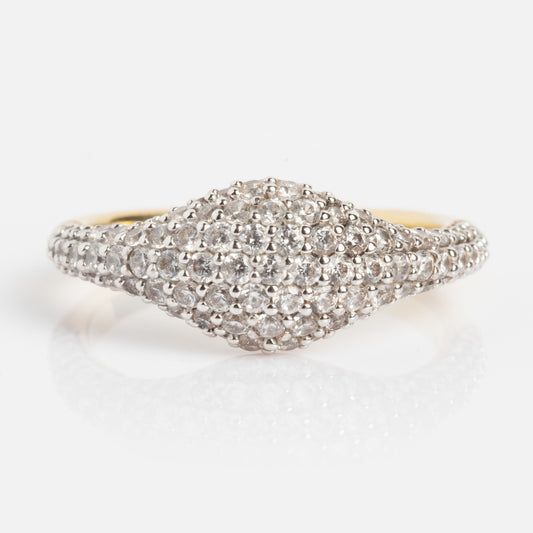 The Pave Signet Pinky Ring features a wide, dome-shaped gold top paved with sparkling white diamonds, displayed on a plain white background.