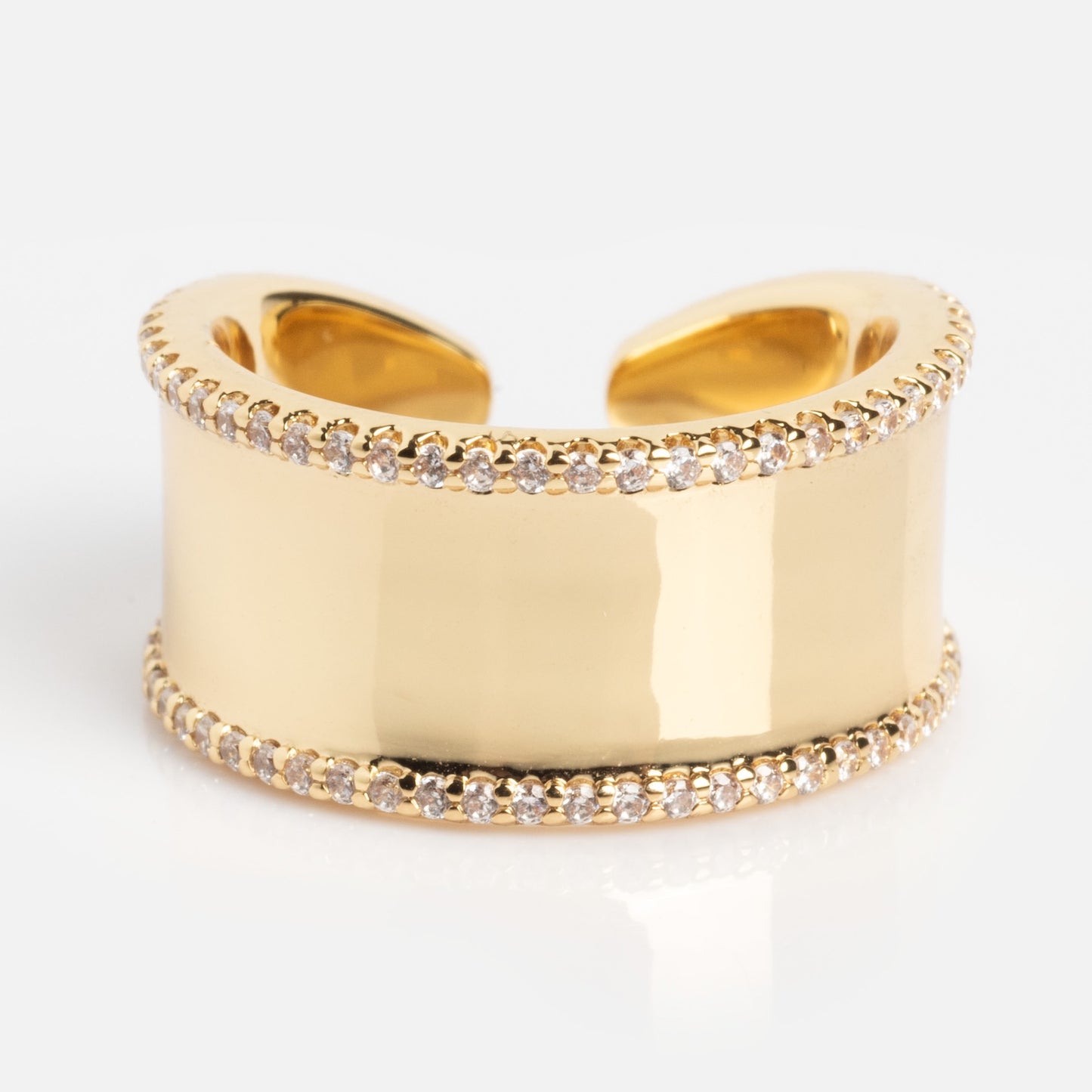 The Open Front Cigar Pinky Ring features a wide gold band with an open back, two rows of clear gemstones on the top and bottom edges, a smooth polished center, and a sleek, modern design.