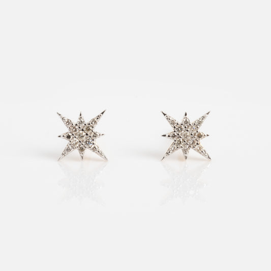 The Solid Gold Diamond Starlight Studs feature multiple pointed star shapes, each set with sparkling diamonds, shown on a white background—ideal for celestial jewelry enthusiasts.