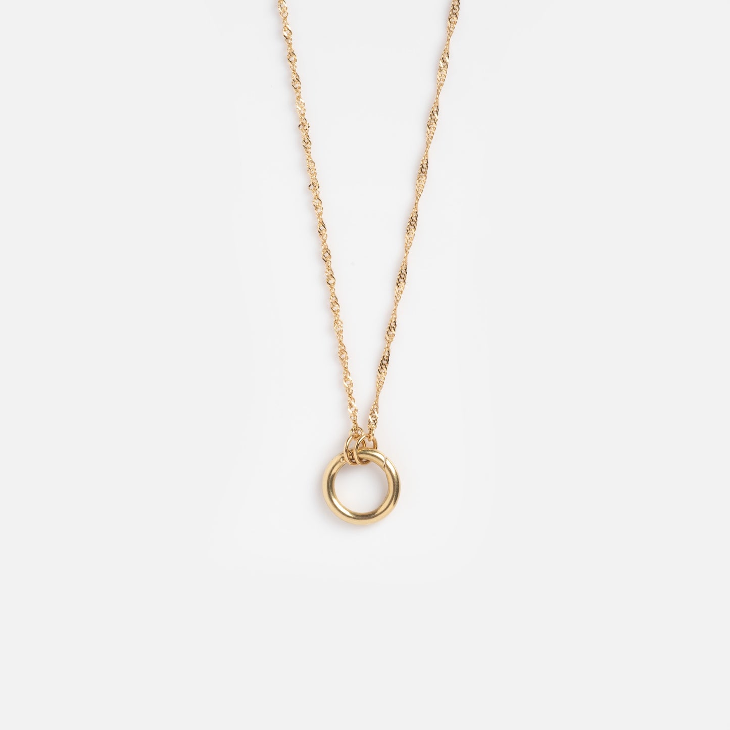 The Solid Gold Perfect Start Charm Holder Necklace features a 9k solid gold twisted chain and a simple circular pendant, shown on a plain white background.