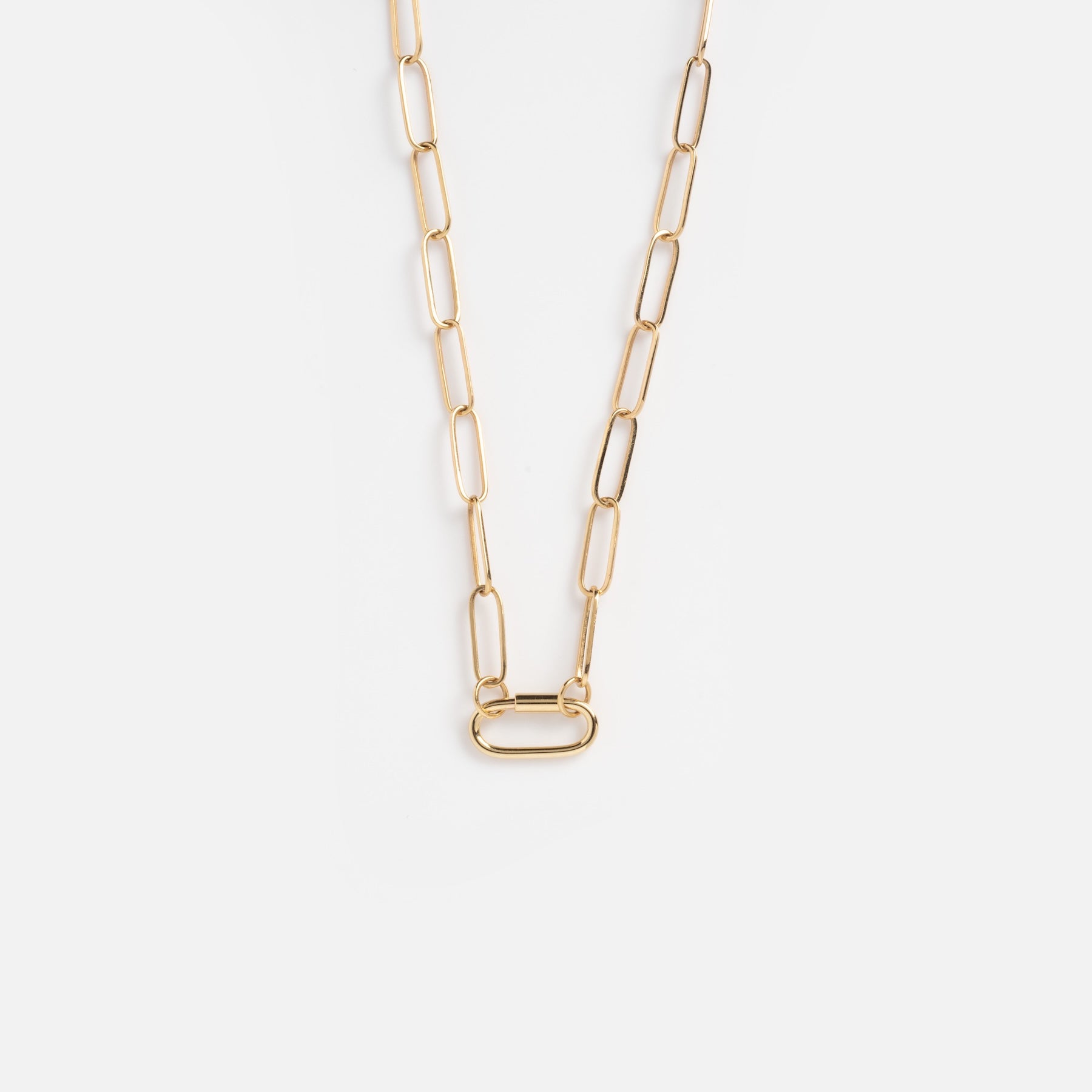 The Solid Gold Perfect Start Charm Holder Necklace is crafted from 9k gold, featuring elongated rectangular links and a central oval-shaped link, shown against a plain white background.