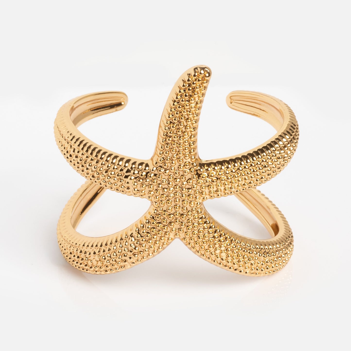 The Golden Nautilus Shell Cuff is a gold cuff bracelet with a nautilus shell design and an open adjustable band, shown on a white background.