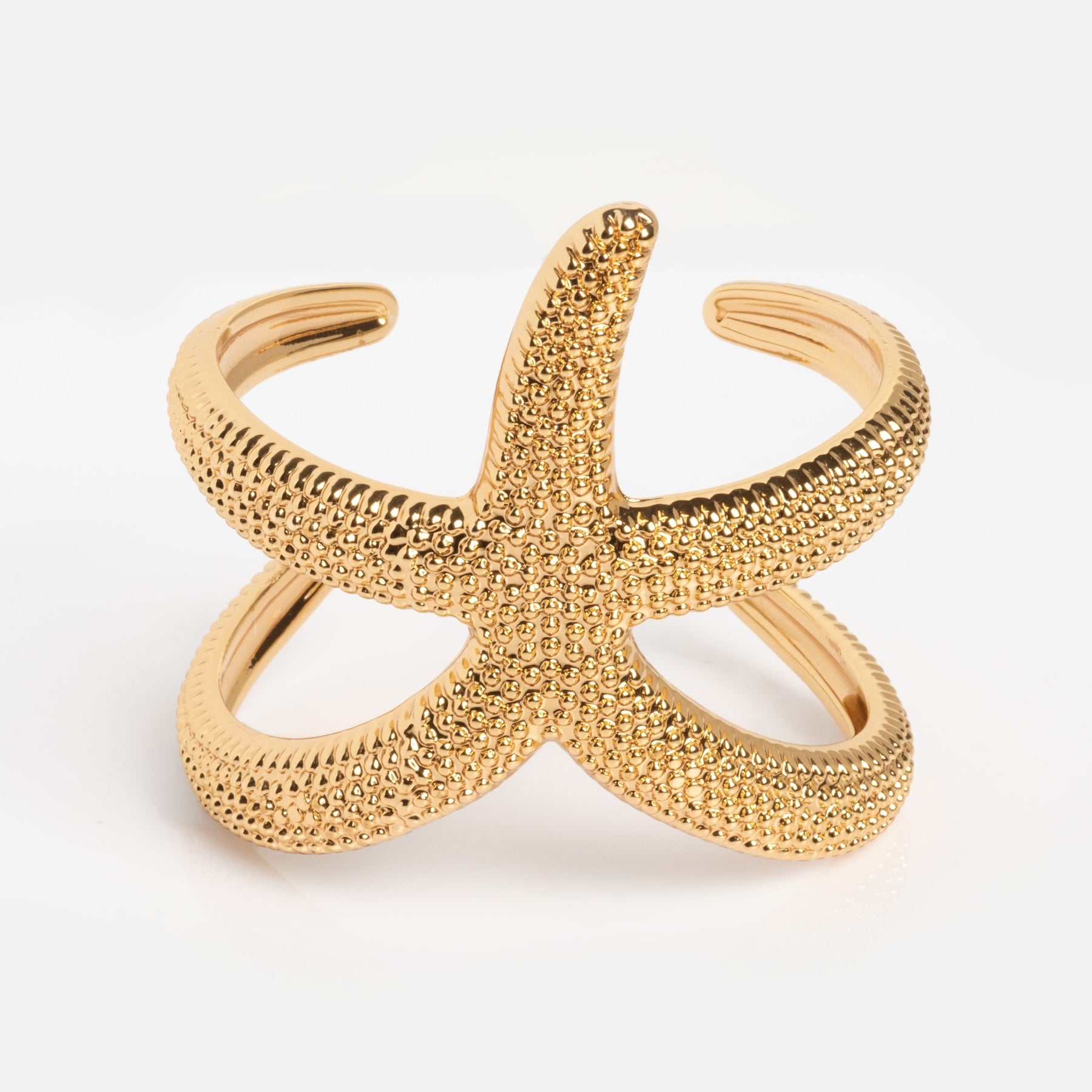 The Golden Nautilus Shell Cuff is a gold cuff bracelet with a nautilus shell design and an open adjustable band, shown on a white background.