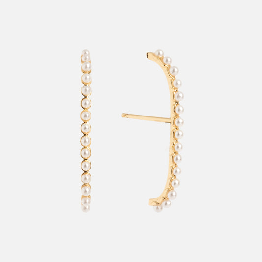 The Simple Pearl Climber Earrings feature a curved gold design accented with a row of small white pearls along the edge, displayed on a plain white background.