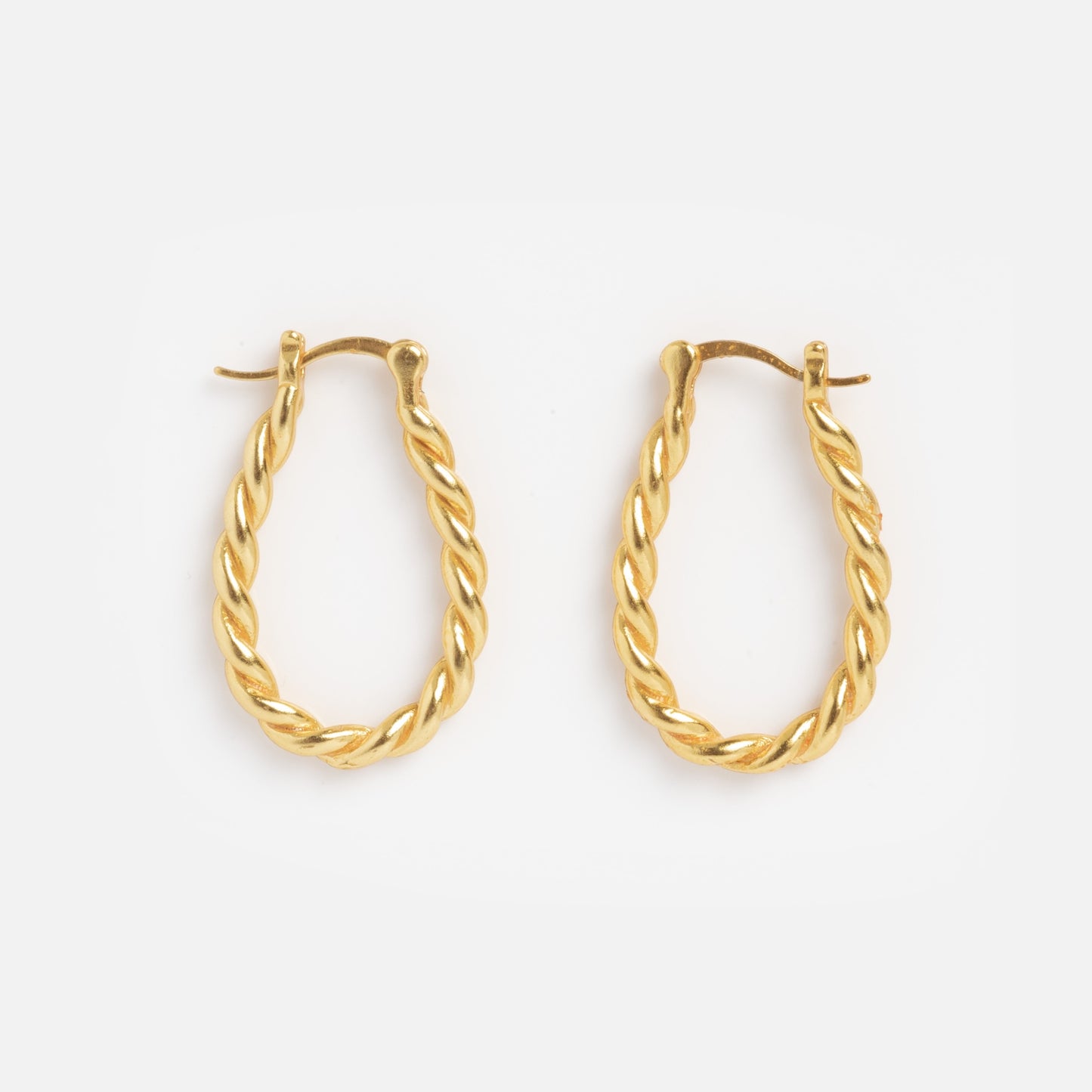 Twisted Oblong Hoops—gold hoop earrings with a twisted rope design—shown on a plain white background.