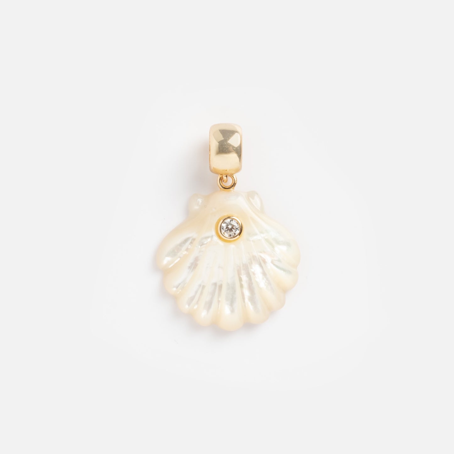 The Charms by Thatch gold pendant features a small iridescent shell with a single round gemstone at its center, adding elegance to personalized jewelry collections. Beautifully showcased on a plain white background.