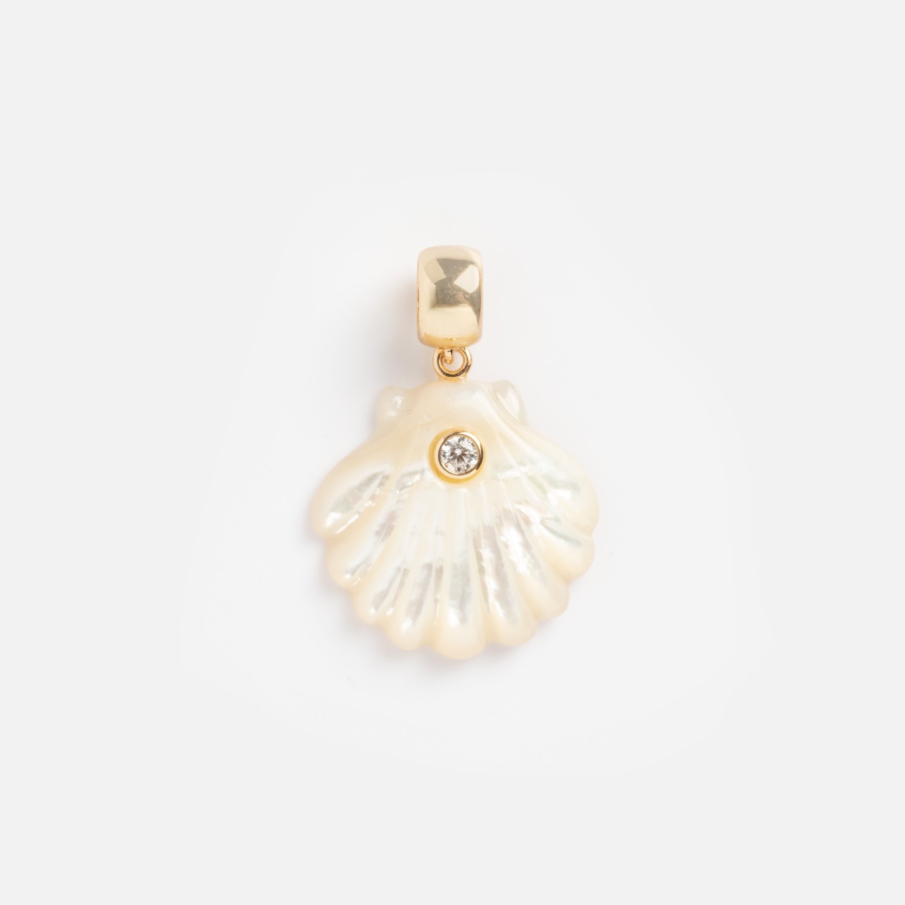 The Charms by Thatch gold pendant features a small iridescent shell with a single round gemstone at its center, adding elegance to personalized jewelry collections. Beautifully showcased on a plain white background.