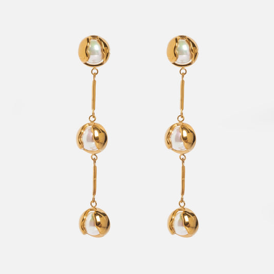 Bisou Earrings: Gold and silver drop earrings with three linked beads, each featuring a gold-plated outer half and silver inner half, shown on a white background.